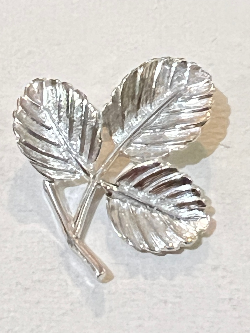 Vintage Sarah Coventry silver-tone triple leaf brooch